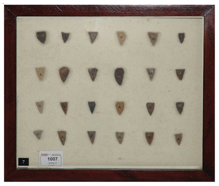Arrowhead/Relic Collection: Framed collection of 25 assorted stone tools or arrowheads of various ages. Circa:Various Size:11" x 13" framed