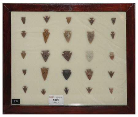 Arrowhead/Relic Collection: Framed collection of 25 assorted stone tools or arrowheads of various ages. Circa:Various Size:11" x 13" framed