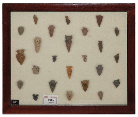 Arrowhead/Relic Collection: Framed collection of 24 assorted stone tools or arrowheads of various ages. Circa:Various Size:11" x 13" framed