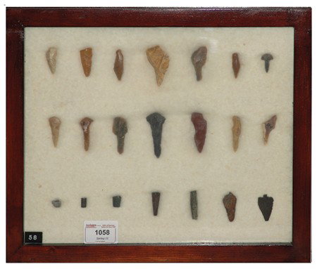 Arrowhead/Relic Collection: Framed collection of 21 assorted stone tools or arrowheads of various ages. Circa:Various Size:11" x 13" framed