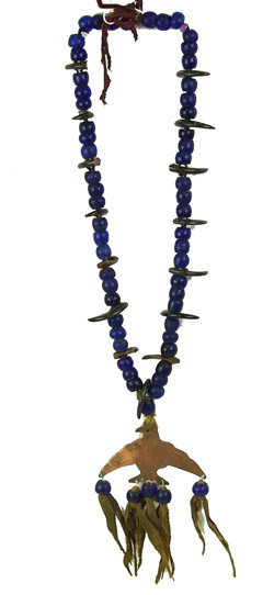 Sioux Bear Claw Necklace: Very rare hand hammered copper eagle pendant strung on large antique cobalt blue trade beads set with 15 small bear claws. Some restoration. Circa Early to mid 1900s. Size 32" long