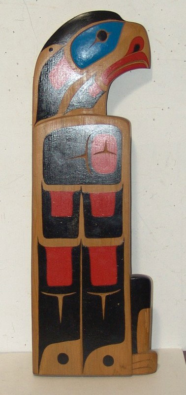 Northwest Coast Carving: Hand carved Northwest Coast cedar eagle totem wall hanging signed Pauls Native Art. 22-1/2" x 7"