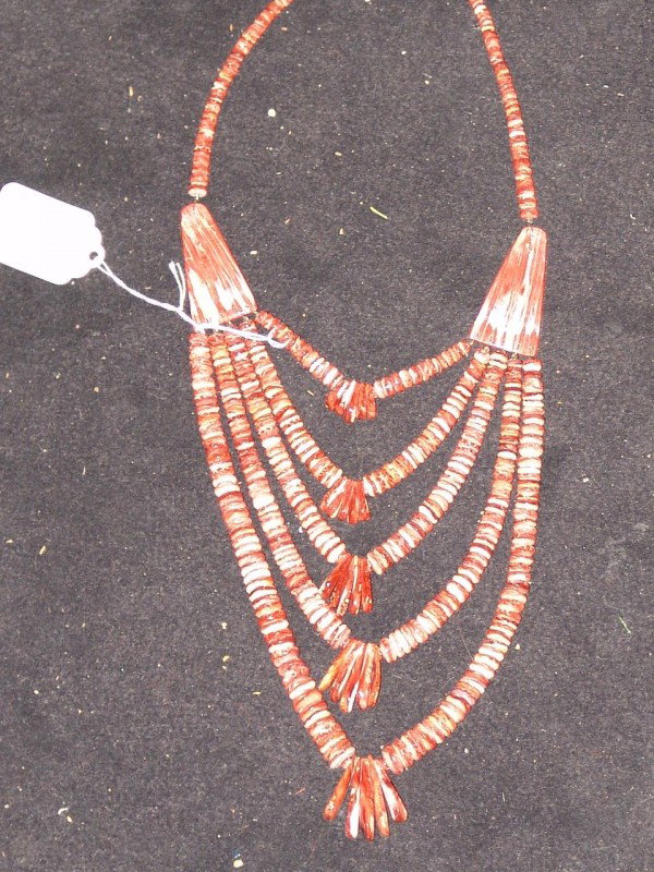 Necklace: Outstanding all hand carved spondulus shell necklace with corn drops and large triangular spacers. Excellent condition. 30" long