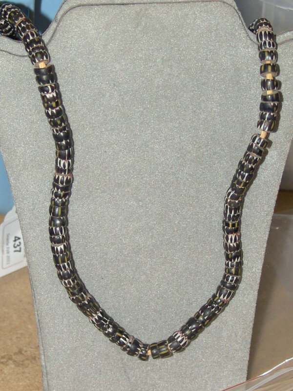 Trade Beads: Rare old strand of squared 4 layer chevron trade beads in black. 23" long