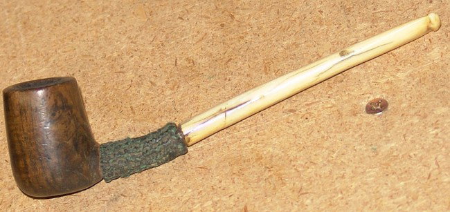 Antique Pipe: Antique carved ivory pipe with burl wood bowl. 6" x 1-3/4"