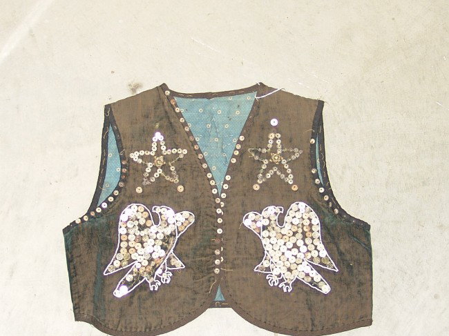 Cree Boy's Vest: Early 1900s Cree boy's vest with eagles and stars done in sequins. Child's