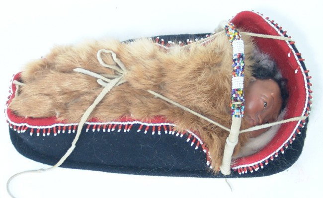 Tlingit Toy Doll Cradle: Tlingit toy doll cradle and doll made from trade cloth and white heart seed beads. 13" x 6"