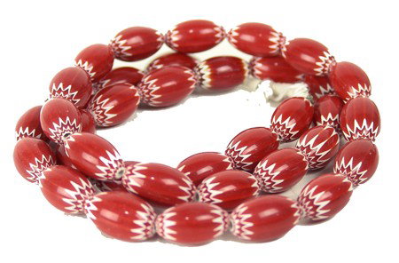 Chevron Trade Beads: Circa Late 1900s, Beautiful strand of high polish 6-layer red oval trade beads. Very good condition. 32" long
