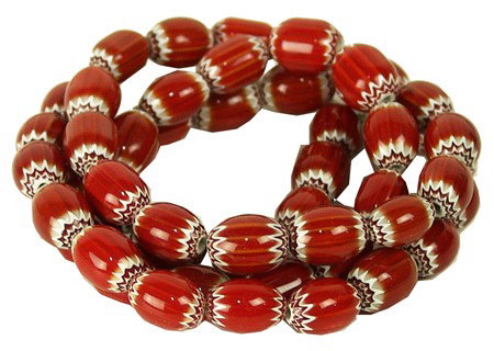 Chevron Trade Beads: Circa Late 1900s, Beautiful strand of 6-layer bright red trade beads. Excellent condition, this is the most sought after size, 5/8 beads." 32" long