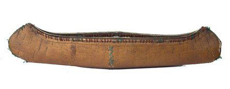 Woodlands Toy Canoe: Circa Early 1900s, Very old larger hand crafted birch bark canoe with yarn sewn seam and Native repairs and etched floral designs. Good condition, split on one end. 29" x 6-1/2"