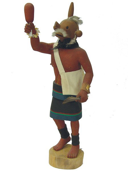 Hopi Katsina Carving- Earl Yowytewa: Circa 1980s, Traditional hand carved and painted cottonwood root mudhead doll with rattle, feather, and shoulder bag. Good condition, minor repairs. 16" + base From the Millican Collection.