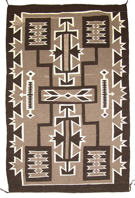 Navajo Rug/Weaving: Circa Mid 1900s, Exciting storm pattern rug from all natural black and white wool on gray ground. Arrow central motif with four corner classic lightning bolt design elements and half star border. 6'7"