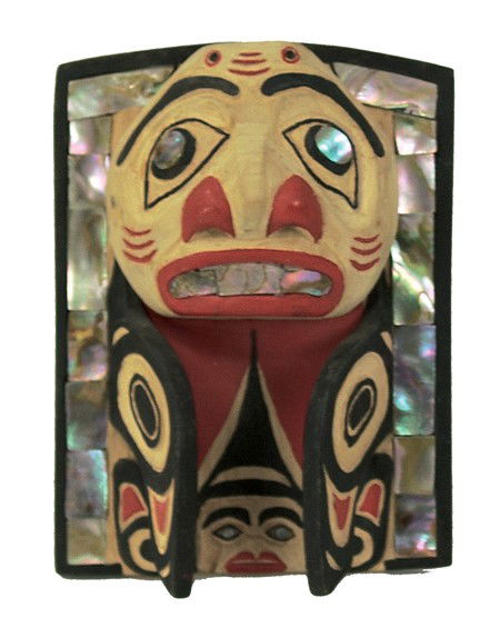Northwest Coast Headdress Frontlet: Circa 1980s, Traditional hand carved alderwood panel with humanoid faces, wings, and inlaid abalone edge. Good condition, unsigned. 7" x 5" From the Johnson Collection.