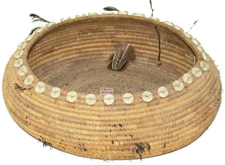 Pomo Basket: Circa Early 1900s, Rather large basketry bowl (originally fully covered with feathers) with shell disc beads and a few quail top-knot feathers. Good condition. 3" x 8-1/2" From the Millican Collection