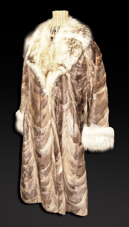 Vintage Fur Coat: Circa Early/Mid 1900s, Fine handcrafted beaver and raccoon skin coat trimmed with coyote fur. Very good condition. Women's medium