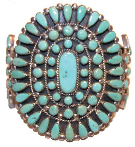 Zuni Bracelet: Circa Mid 1900s, Marvelous Zuni bracelet with tear drop and petit point cluster work on three sterling bands. 7" x 3" + 1-1/4" gap