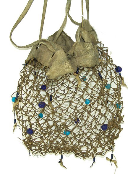 Athabascan Babiche Bag: Circa 1900, Very rare net/woven babiche (fine sinew or gut thong) bag with moose hide top and strap and woven in glass beads. Very good condition. 9" x 8"