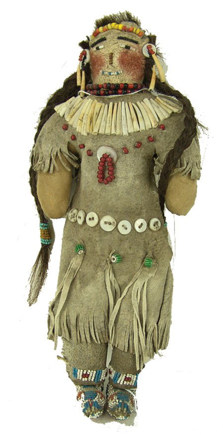 Plains Beaded Doll: Circa Early/Mid 1900s, Fine hand crafted doll with commercial buckskin dress, moccasins, leggings, dentilium yoke, and human hair. Very good condition. 10-1/2" tall