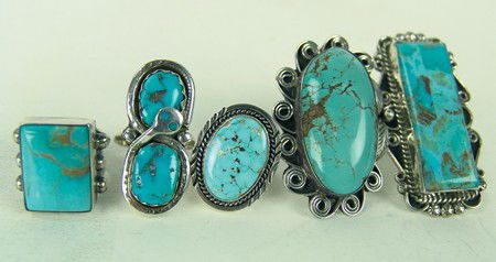 5 Navajo Rings: Circa Late 1900s, Collection of five exceptional large stone Navajo turquoise and silver rings, one by Effie Calavaza. All in very good/excellent condition. Various