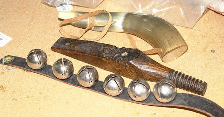 Historical Lot: 3 Pieces: Collection of antique items: set of dance bells, powderhorn, and insulator base. Size: 12 x 2" largest"