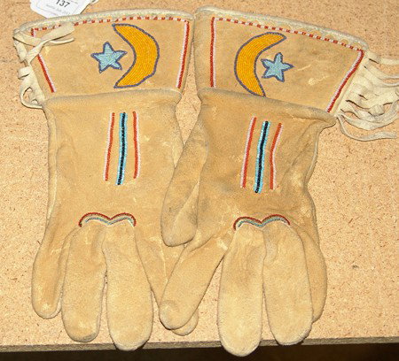 Shoshone Boys Gloves: Beautiful pair of buckskin and beaded gauntlets with rare moon and star design. Very good condition. Circa: 1980s Size: Men's small
