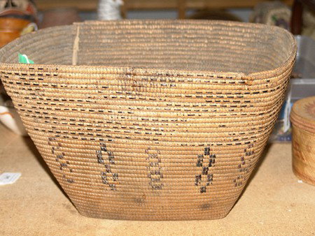 Salish Basket: Rare rectangular flared hard sided Thompson River Salish cooking basket with some rim damage. Circa: Circa Late 1800s Size: 8-1/4 h x 13-1/2" x 11-1/4" w"