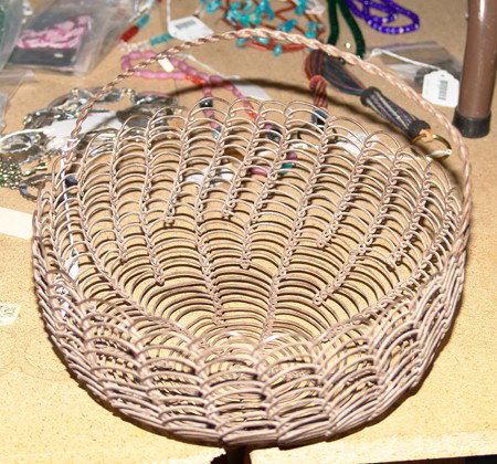 Papago Wire Basket: Rare hand woven Papago wire basket with handle in good condition. Circa: Circa 1940 Size: 5-1/4 x 10""