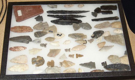 Points and Blades in Frame: Framed collection of 62 miscellaneous stone and obsidian points, tools, and blades - including a pipestone tomahawk. Size: 3/4 to 6-1/4""