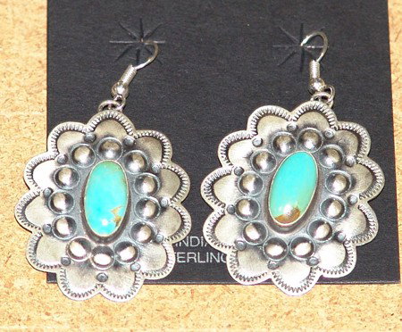 Navajo Earrings: Pair of traditional Navajo hand stamped turquoise and silver rosette earrings. Size: 1-1/2 x 1-1/4""