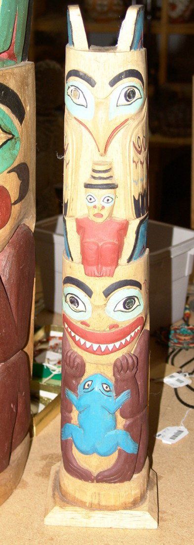 4-Figure Totem: Hand carved Northwest Coast style 4 figure totem pole with abalone inlaid eyes. Size: 20 x 4-3/4""