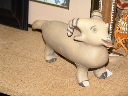 Cochiti Pottery Ram- Maria Laweka: Rare hand formed pottery ram figure with painted horns and details. Snout chipped, tail and 2 legs repaired. Circa: Mid-late 1900s Size: 6 x 11""