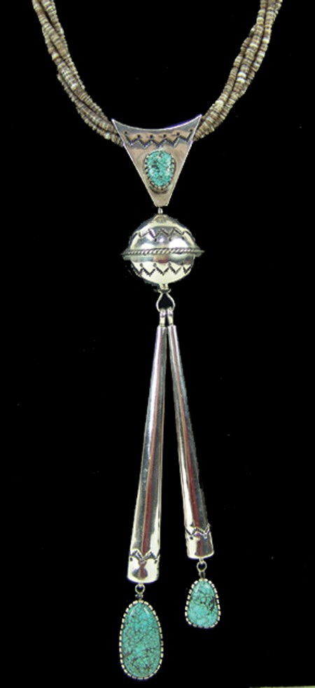 Navajo Necklace - James Little: 1977, Exquisite turquoise and silver necklace strung on four strands of fine shell heshi. This is the necklace featured on page 33 of the April 1979 Arizona Highways (copy included). Excellent conditi