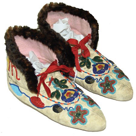 Tlingit Moccasins: 1940s, Rare pair of toe-seam buckskin moccasins with fine beaded floral designs. From Chatham Straits Village. Good condition. 9-1/2"