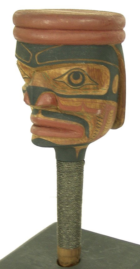 Kwakiutl Rattle - Calvin Hunt: 1982, Beautifully carved speakers rattle in human form with wrapped handle. Very good condition. 10-1/2" x 4-1/2" From the Watts collection.