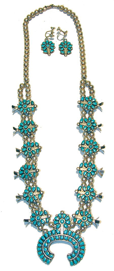 Zuni Squash Blossom Set: Mid 1900s, Exquisite squash blossom with handmade sterling beads, petit point turquoise stones, and matching screw-back earrings. Very good condition. 25" long