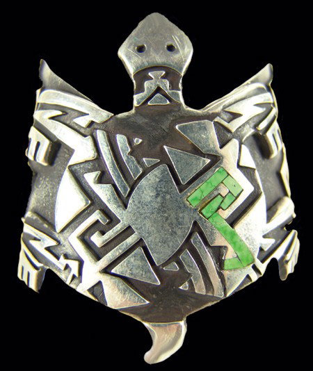 Hopi Bracelet: 1990, Fine contemporary design silver overlay bracelet with large frog figure and inlaid green turquoise stone. Very good used condition. 5-1/2" x 2-3/8" + 3/4" gap