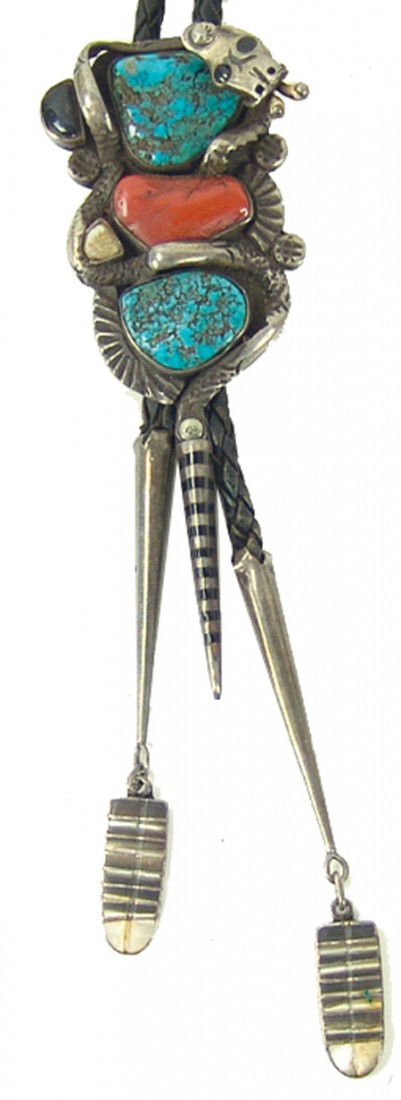 Navajo Bolo Tie: 1970s, Original design silver bolo with turquoise, coral, shell, and jet stones set within an encompassing rattlesnake, the lower pendulum being the rattles. Very good used condition. 5" x 1-1/2"