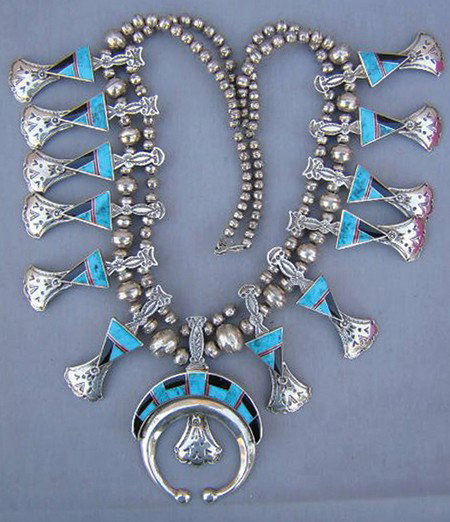 Navajo Necklace - Charles Willie: 1980s, Gorgeous silver and channel inlay squash blossom necklace of coral, turquoise, and jet with benchmade silver beads, hallmark "CW." Excellent condition. 26" long, 2-1/2" naja