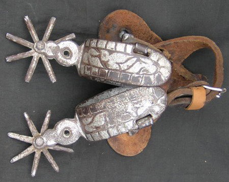 Spurs: 1920s, Nice pair of leather and silver inlaid iron Mexican spurs. Good condition. 6" x 3-1/4"