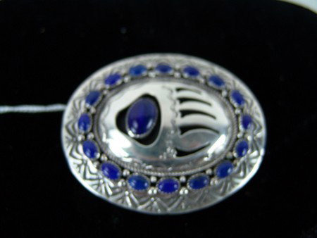 Navajo Buckle - W.M.: Late 1900s, Very fine Navajo lapis and silver oval buckle with shadow box bear paw signed W.M. Excellent condition. 2-1/2" x 3"