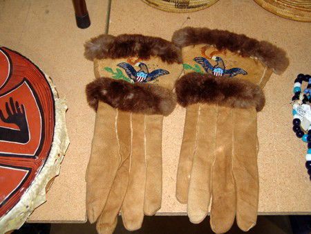 Tlingit Beaded Gauntlets: Mid 1900s, Beautiful pair of mink trimmed moosehide gloves with beaded eagles on cuff. Very good condition, these might be Athabascan. 15" x 5"