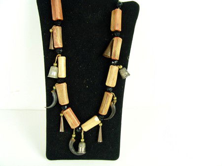 Sioux Necklace: Early to mid 1900s, Rare Sioux bone and claw necklace with thimbles and faceted tradebeads. 25"