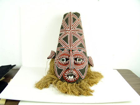 African Mask: Mid to late 1900s, Makichi mask from Zambia, handcrafted and painted tree bark mask with exagerated facial features. Very good condition. Ex: Field Museum store, Chicago. 21" x 13"