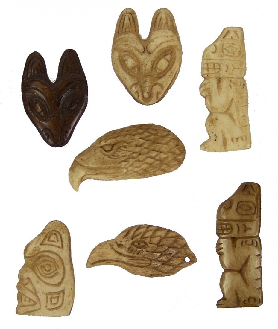 7 Northwest Coast Effigies: Framed collection of seven hand carved totemic bone figures. All in very good condition. Circa: Mid-late 1900s Size: 1-5/8" longest