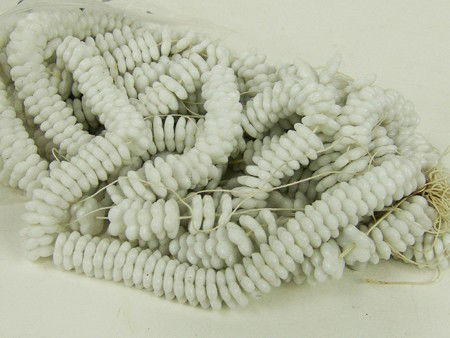 Tradebead Collection: Bagged collection of old Czech flower cut milk glass tradebeads on original strings. Very good condition. Circa: Early/Mid 1900s Size: 1/8" each