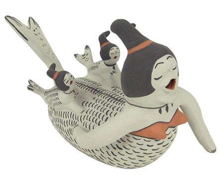 Cochiti Pottery Figure - Martha Arquero: Beautiful original design "storyteller" figure done as human/fish figures. Very good condition. Circa: 2002 Size: 6" x 11" x 7-1/2"