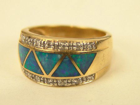 Gold Inlay Ring: Fine 14 kt gold ring set with opaline and trimmed with tiny diamonds(?). Very good condition. Circa: Late 1900s Size: Size 7-1/4