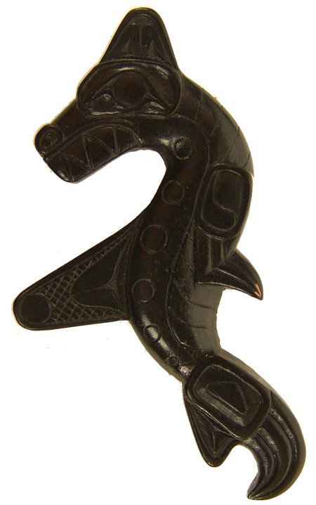 Haida Argillite Pin- Pat McGuire: 1969, Rare finely carved black argillite pin in the form of a serpent. Very good condition. Ex: Dockstader collection with provenance. 1" x 2-1/4"