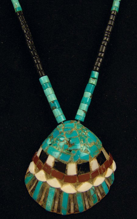 Pueblo Shell Necklace: 1970s, Classic old style shell pendant with turquoise, mother-of-pearl, and jet overlay strung on turquoise and jet heshi. Very good condition. 16" long, 2-1/2" x 2-1/2" pendant