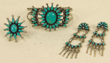 Zuni Bracelet Set: Fine petit point sterling silver bracelet and matching ring plus earrings. All set with turquoise stones. Very good condition. Size: 5-7/8" x 1-1/2" + 7/8" gap/ ring size 7 Circa: Late 1900s
